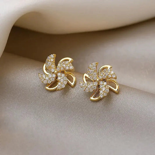 Gold hoop earrings with zircons