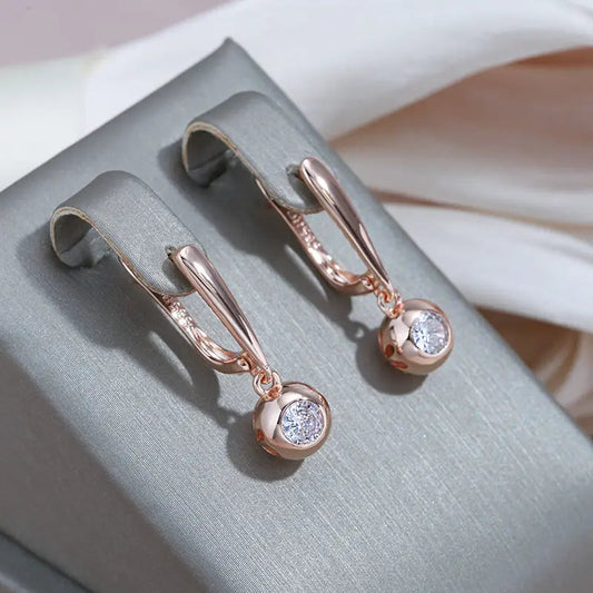 Gold earrings with crystal ball